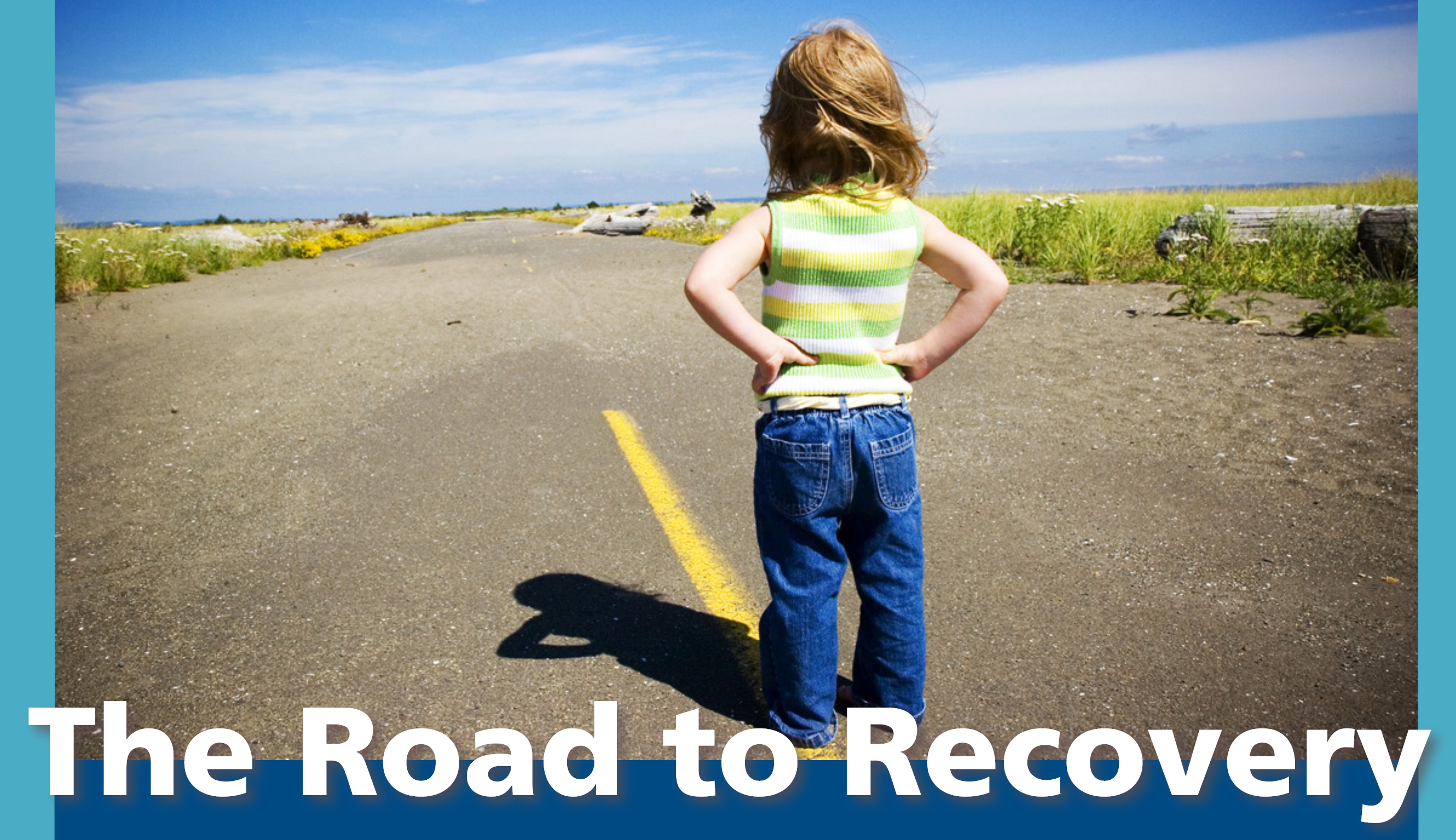 a child with hands on hips looking down an empty county road