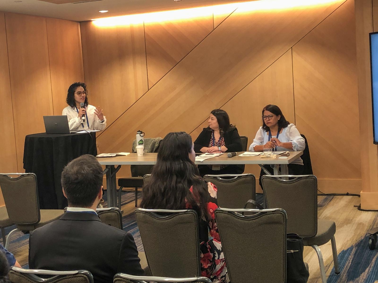 Image of Jasmine Brown-Hollie, Sandra Vanegas, and Yolanda Suarez-Balcazar presenting.