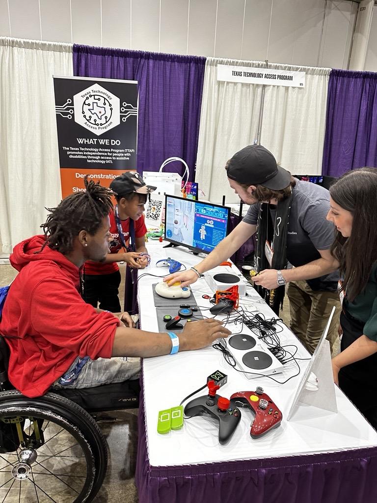 TTAP team members demonstrate accessible video game controllers.