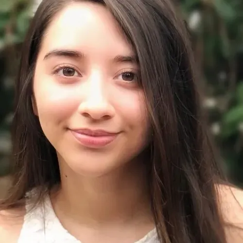 Latina with lighter brown features and straight brown hair