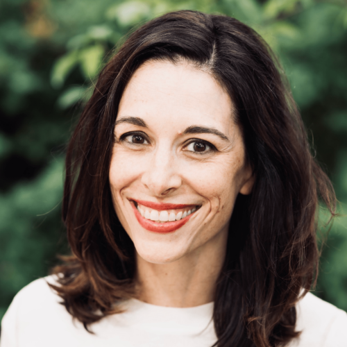 Brunette with a striking smile and white woven sweater